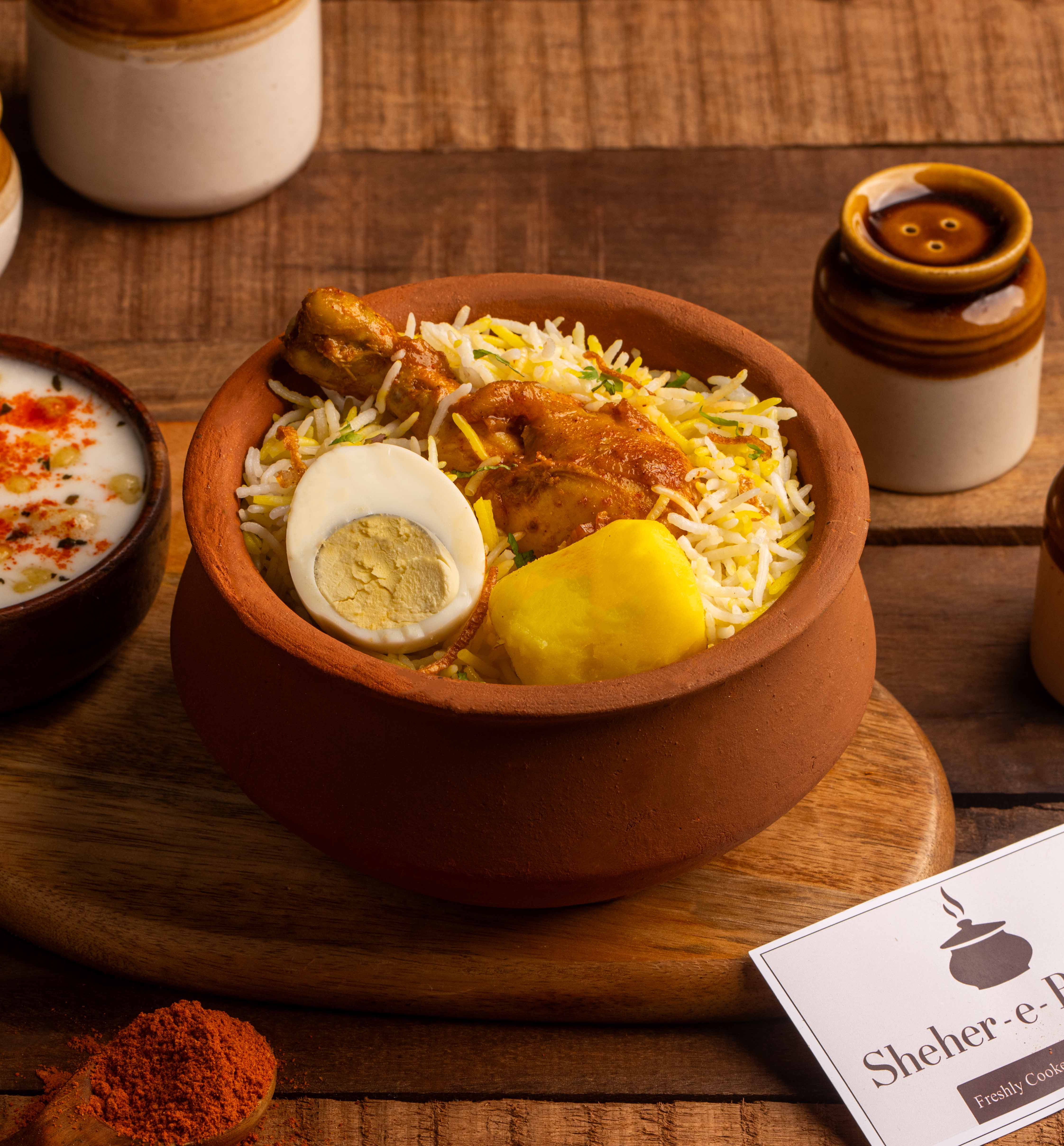 Authentic Kolkata style Matka Biryani with signature potato and boiled egg